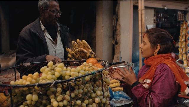 Man and woman on the fruit market in Kathmandu, Nepal