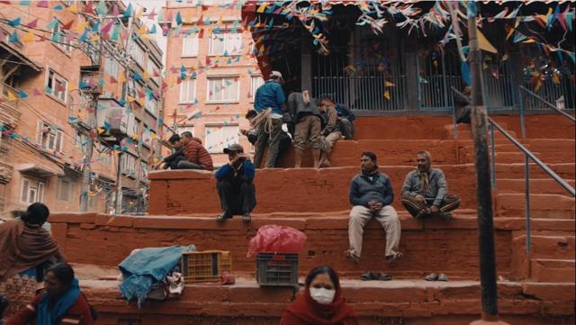 People sitting on the street stairs in Kathmandu, Nepal