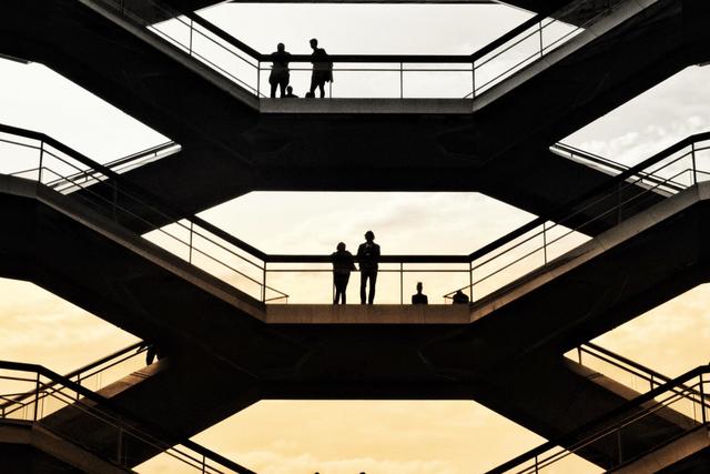 Silhouettes of people inside a building