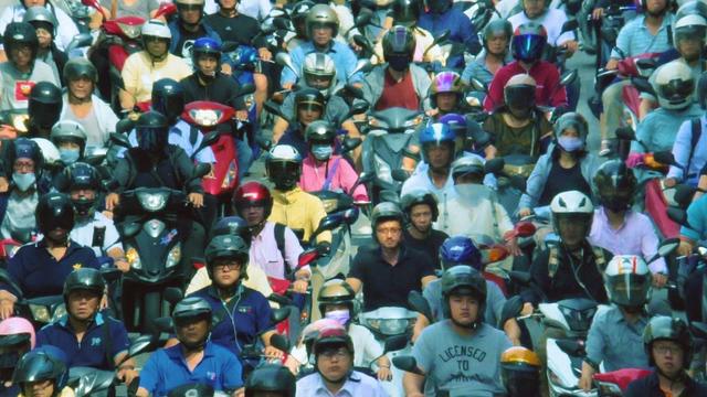 A mass of Taiwanese motorbikers on the road