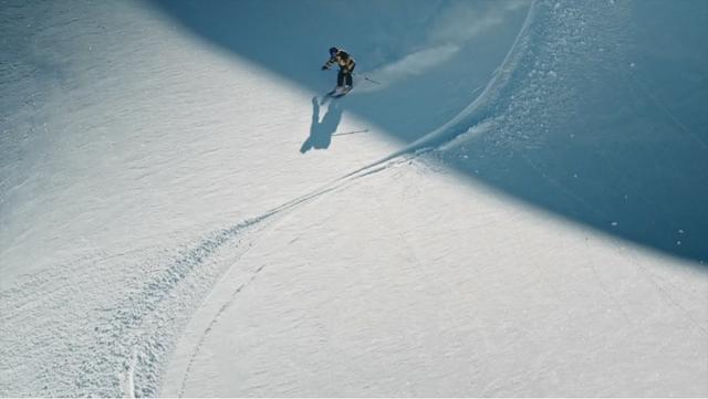 Sam Favret skiing down in the Chamonix area on a sunny day