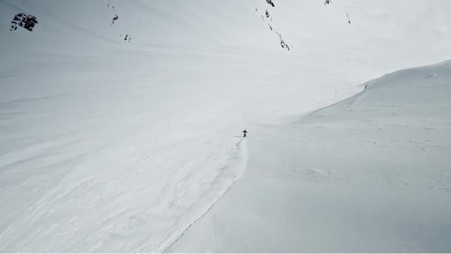 Sam Favret skiing down a steep slope in the Chamonix area, Mont Blanc