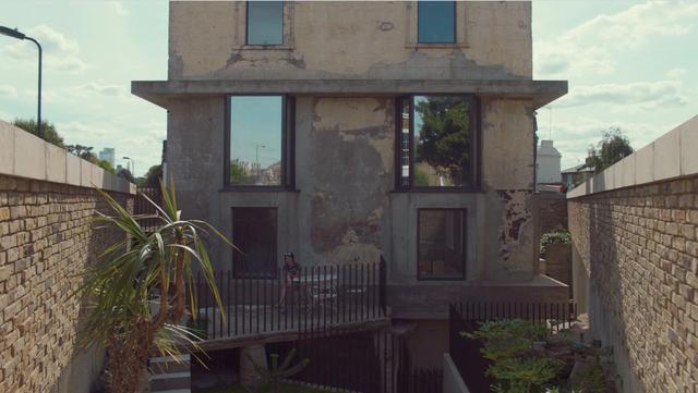 Sue Webster sitting ont he terrace of her house in Hackney, London