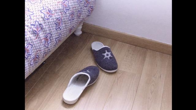 Slippers on the wooden apartment floor