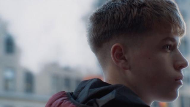 Face of a boy standing on the street in New York City