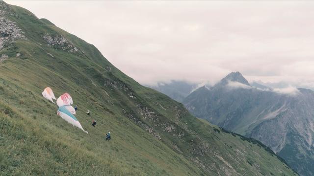 Paraglider resting on the mountainside