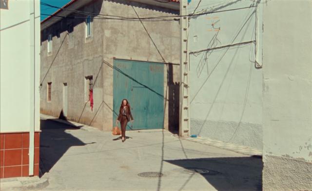 Actress Rachel Lascar walking through the sunny Andalucian streets